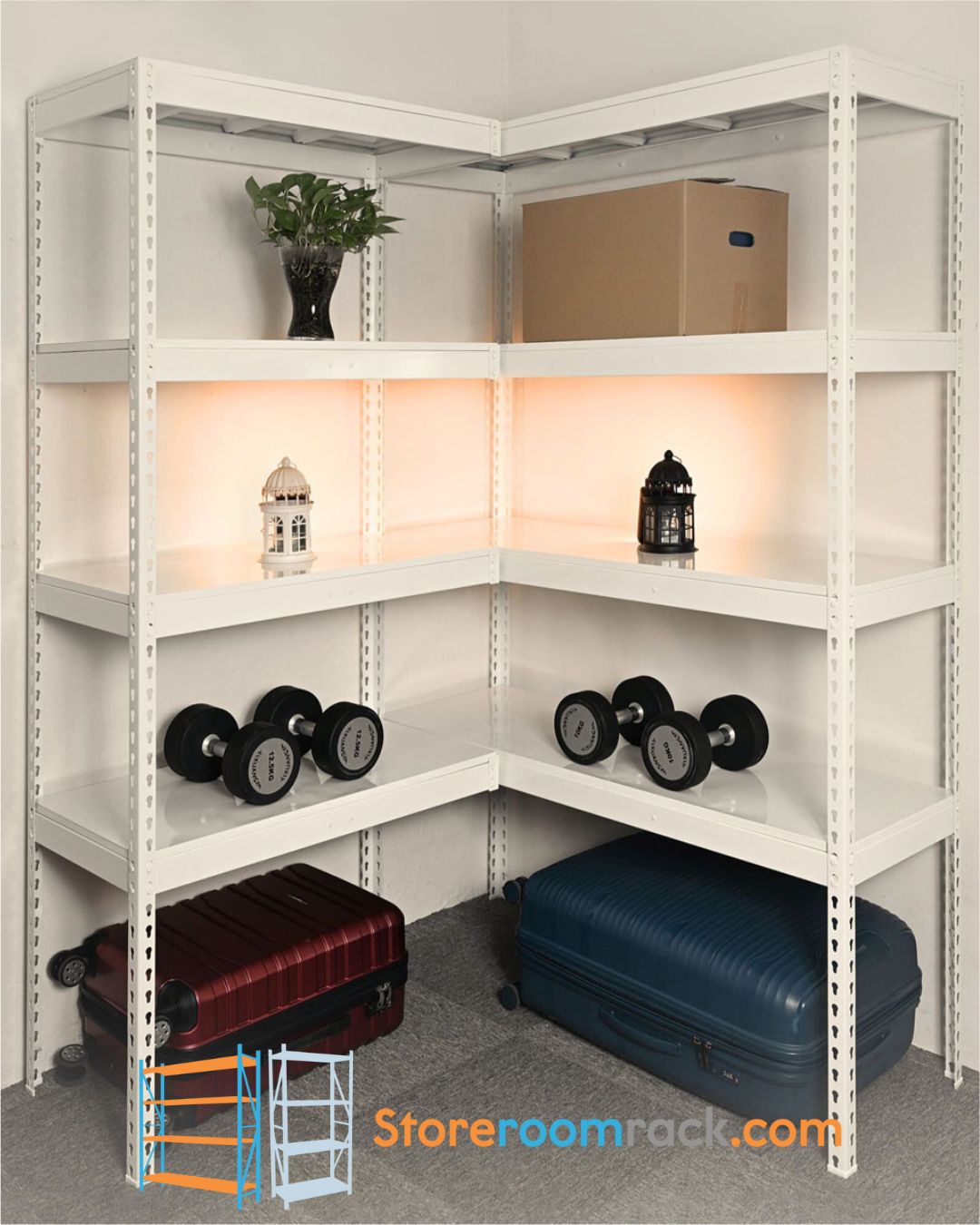 White L-shaped boltless corner rack holding a plant, a storage carton, lanterns and dumbbells, with two suitcases stored underneath and the corner shelf running unbroken across both walls