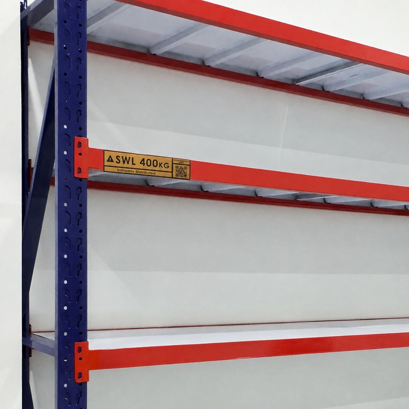 Yellow SWL 400kg load label fixed to an orange rack beam at eye level